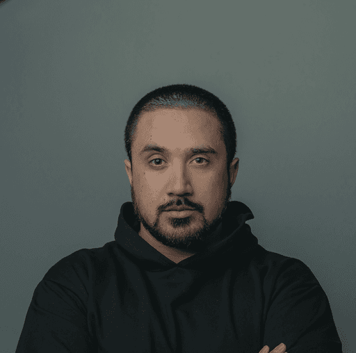 man in black hoodie standing