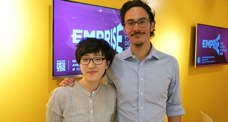 man and woman in front of screen