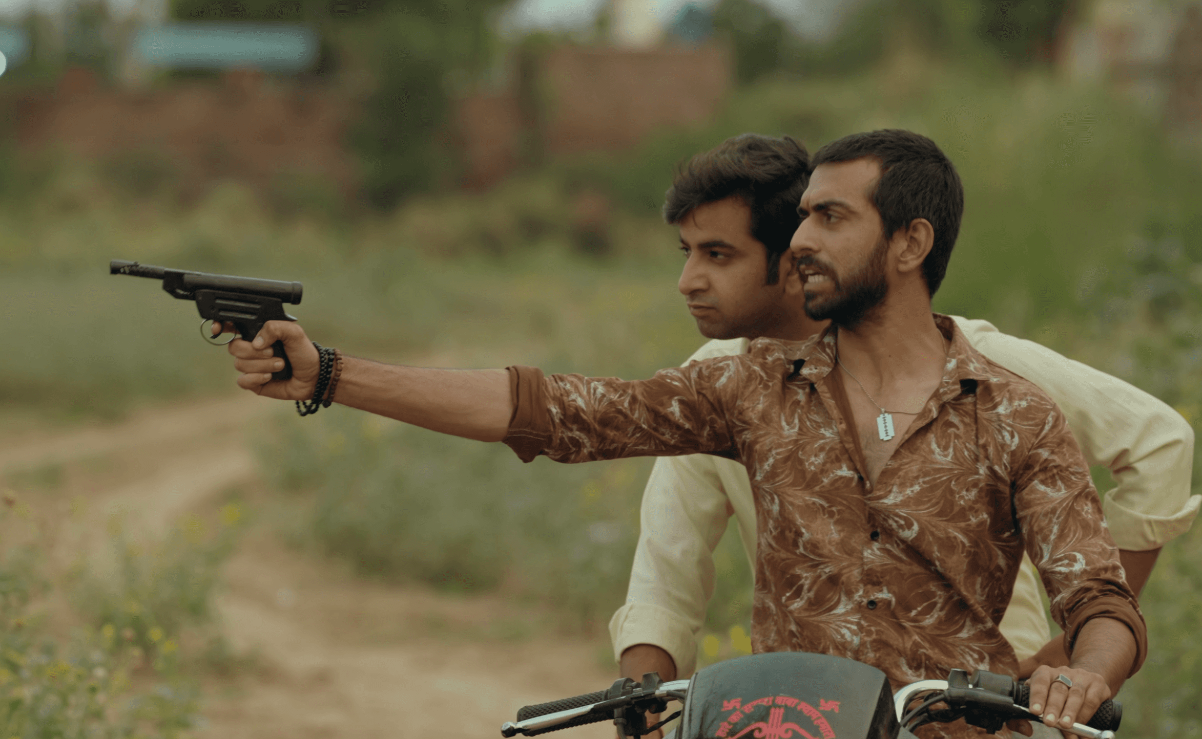 Bajri Mafia thumbnail featuring 2 actors on bike with a gun