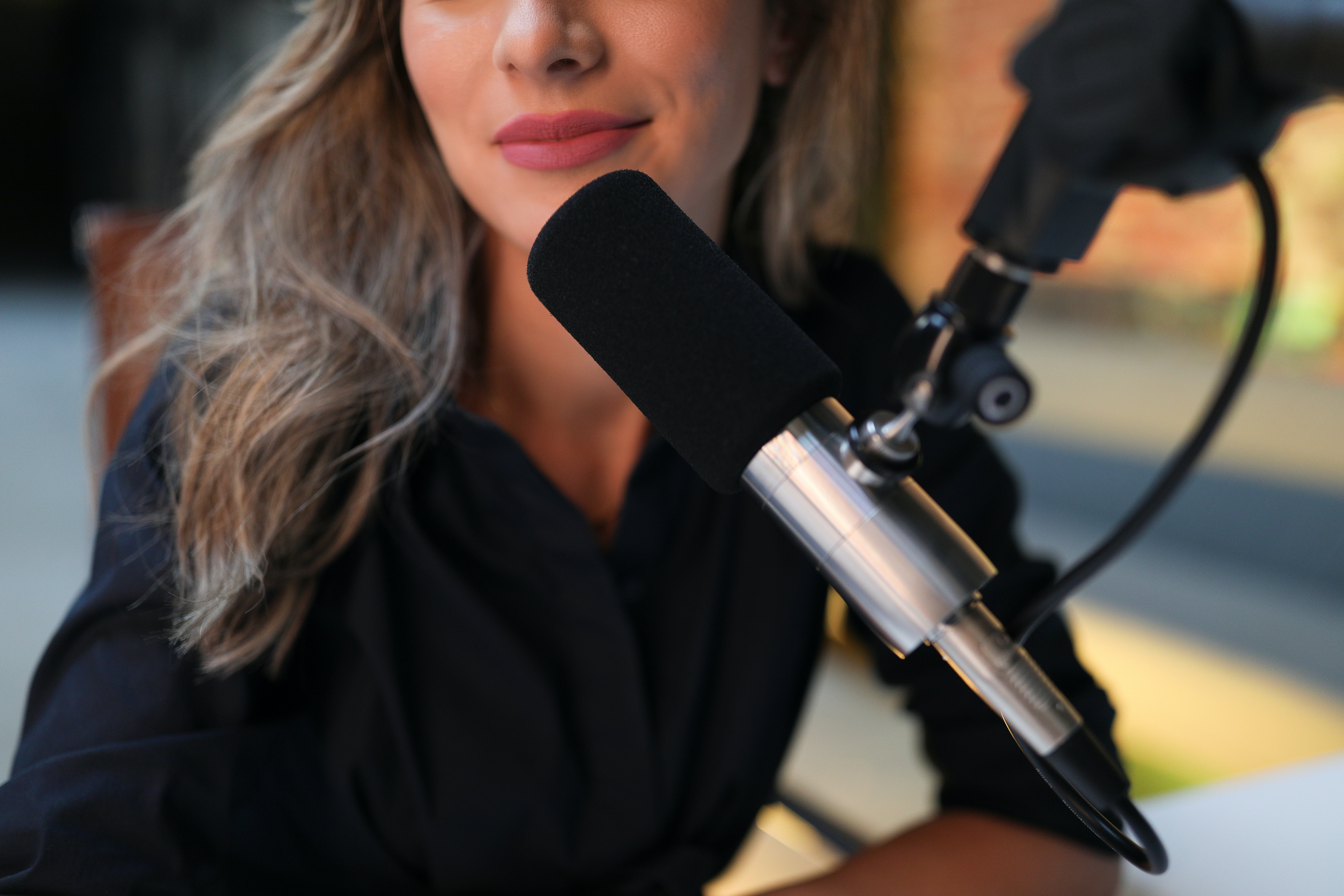 Woman with microphone infront of her - female voice types
