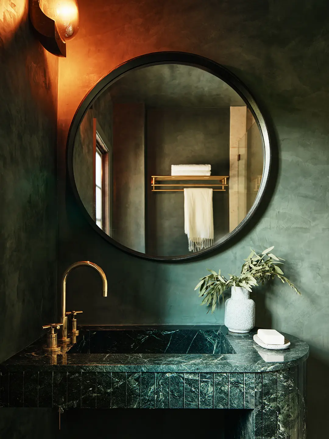 Dark green roman clay in bathroom