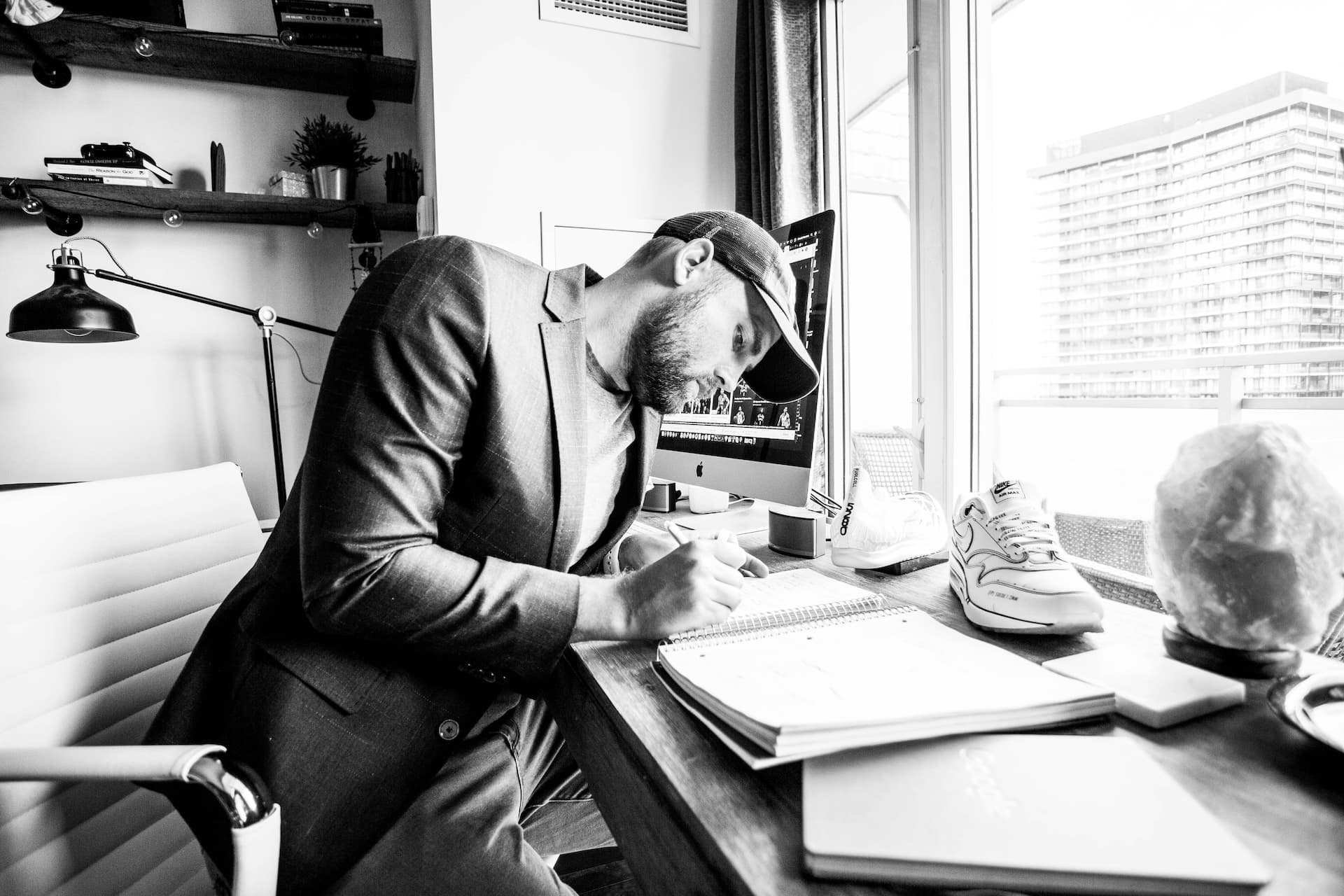 Designer Chadd Weston sketching UX concepts at his desk in Toronto, Canada
