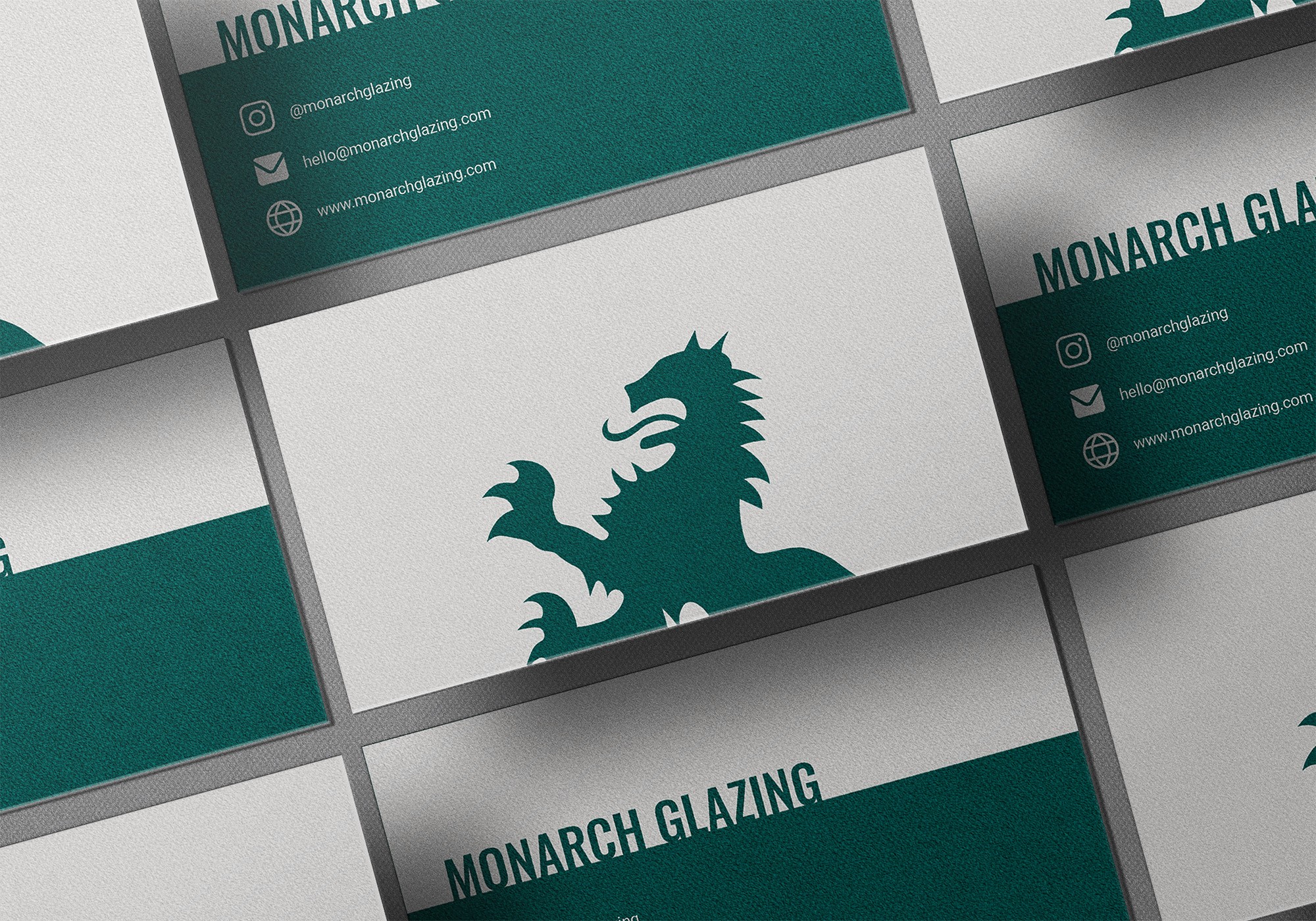 Monarch Glazing's business cards in green and off-white