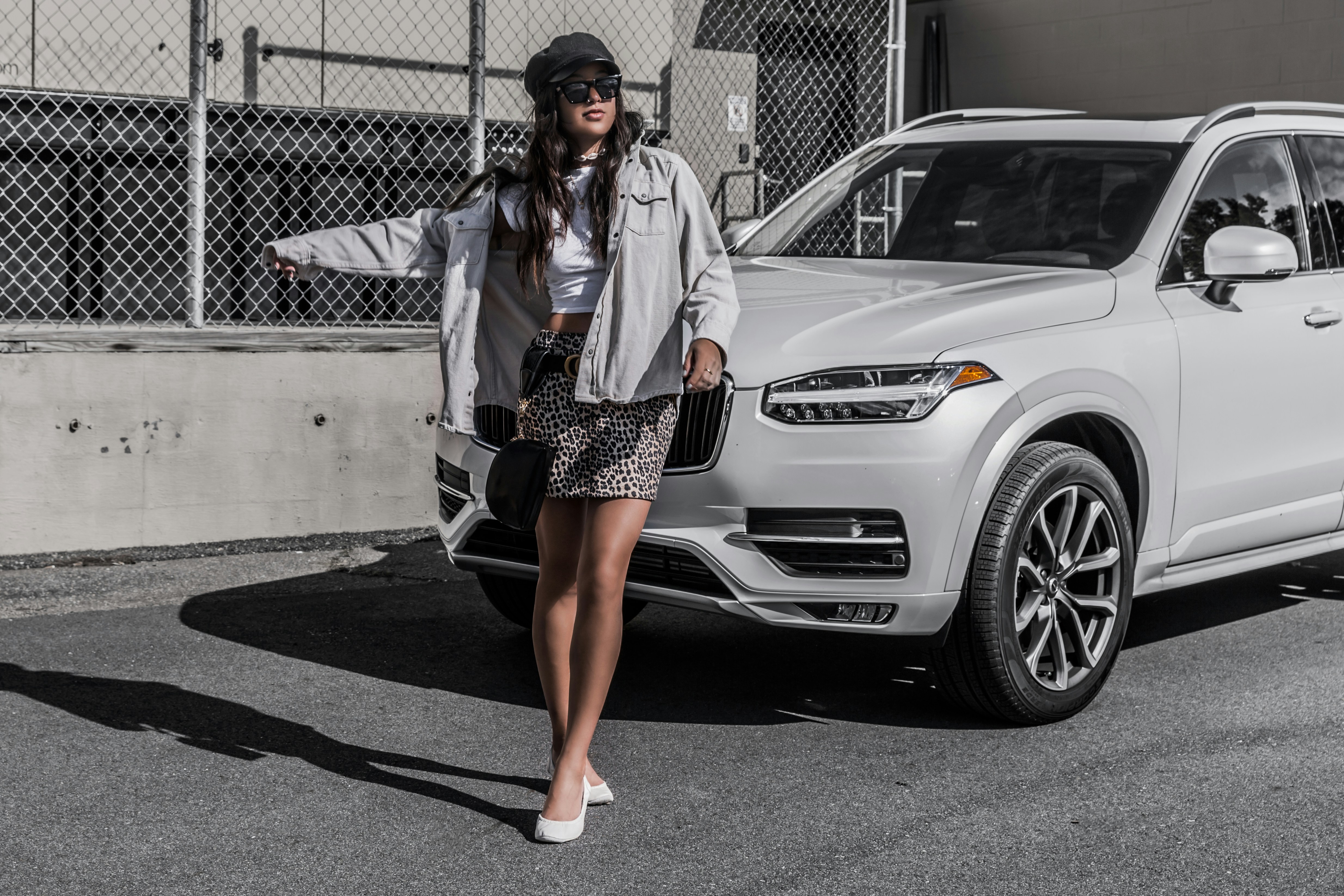 woman infront of a car - Preppy Stuff