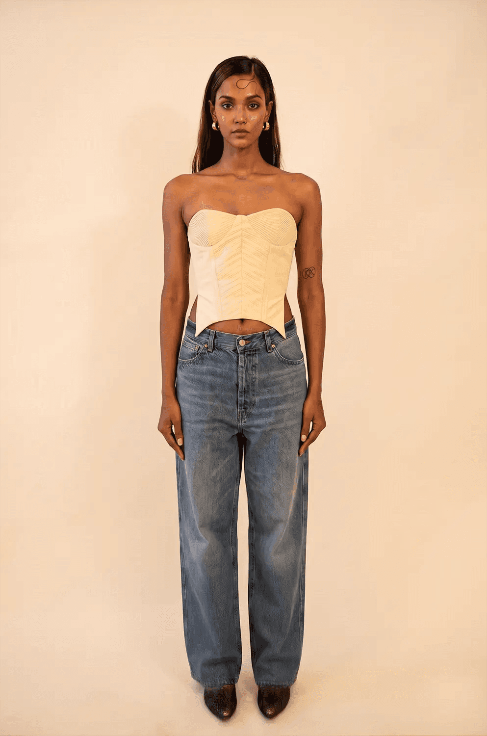 Off-white strapless corset featuring cording detail, handcrafted from upcycled vintage fabric, designed for a structured fit and conscious style
