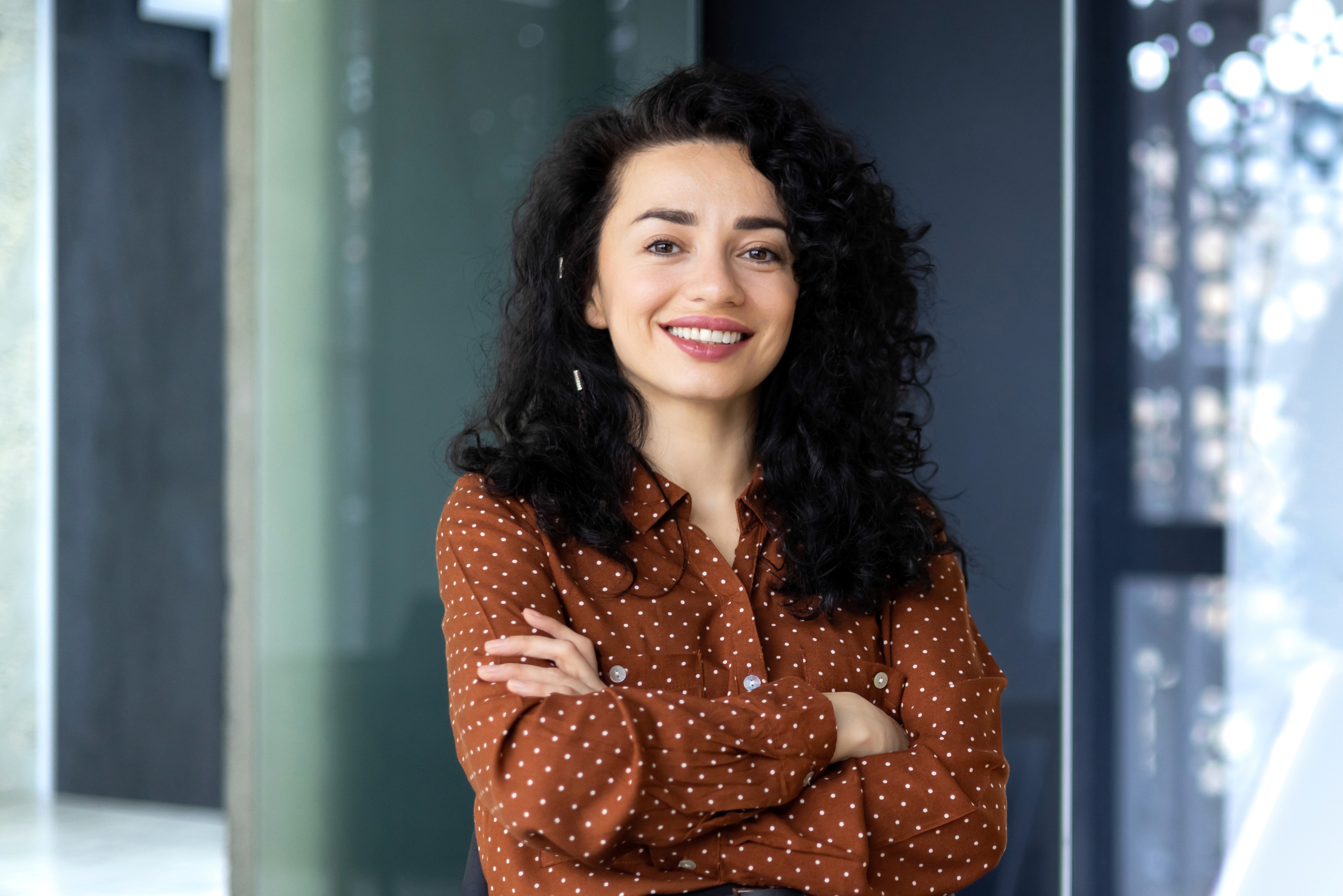 woman in blouse smiling