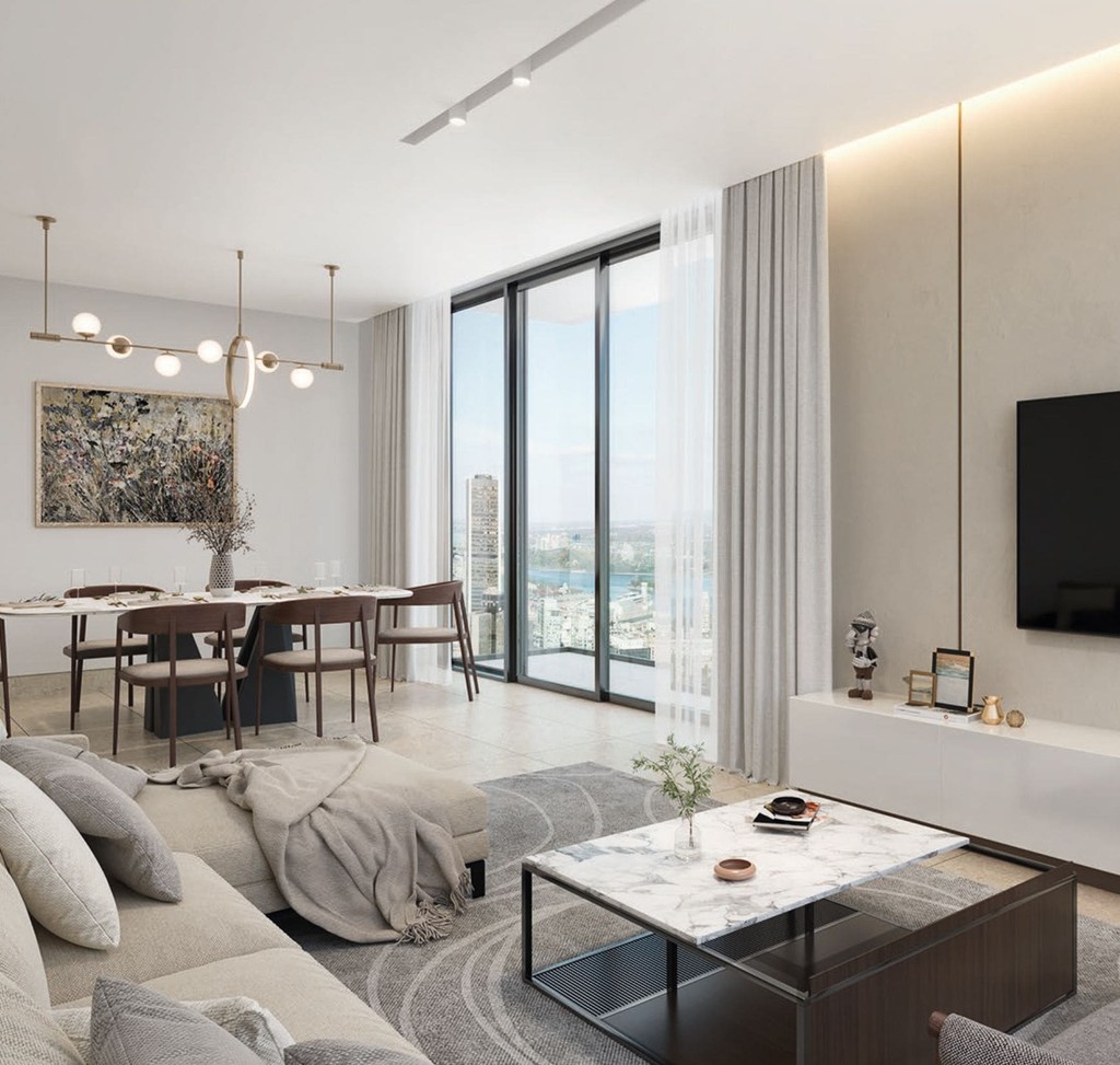  Contemporary living room at Sobha Verde, showcasing a spacious layout with a large flat screen TV.