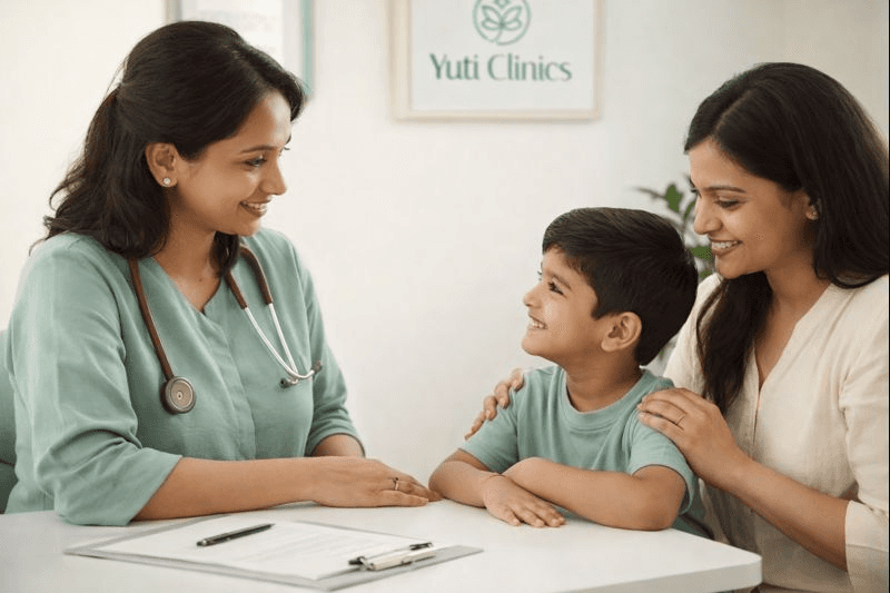 Close-up of lush, dark green leaves, some glossy and wet, against a muted background.