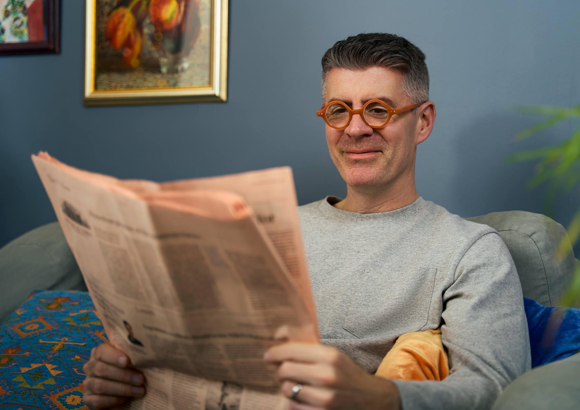 A man wearing brown Izipizi glasses, photographed by Matthew Brown.