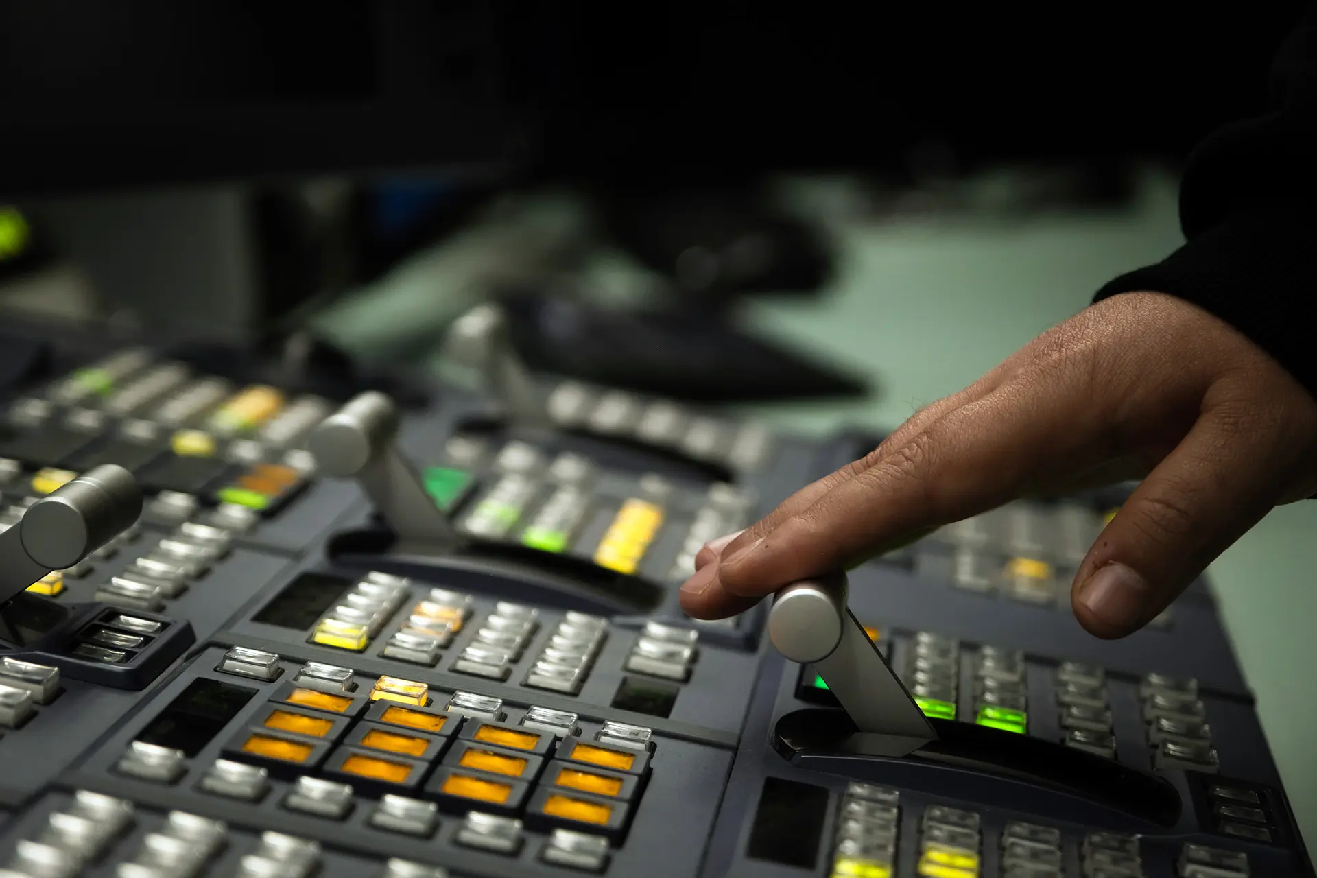 Close-up of a broadcast vision mixer in use during a live production.