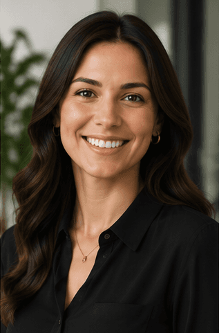 Professional portrait of a smiling businesswoman in a black top.
