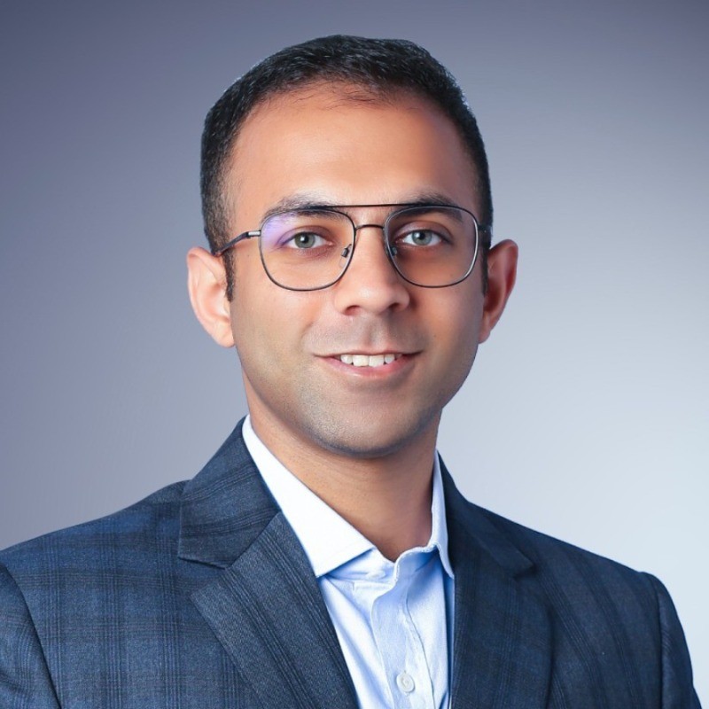 smiling woman wearing white and black pinstriped collared top