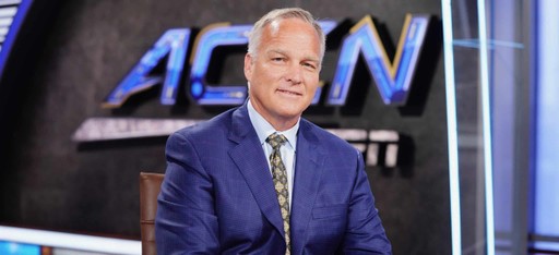 Mark Richt in a blue suit and patterned tie sits in a studio with an ACCN and ESPN logo displayed behind him.