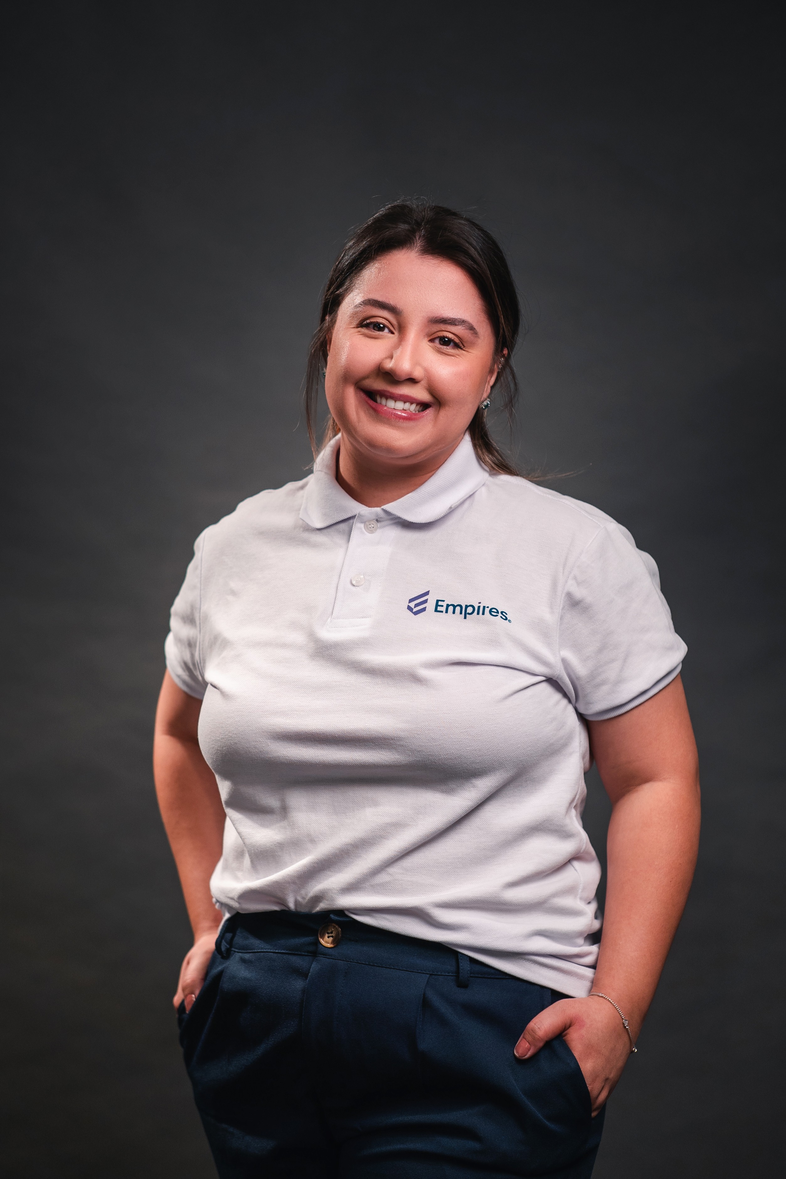 woman in black crew neck t-shirt wearing brown framed eyeglasses standing on rocky shore during