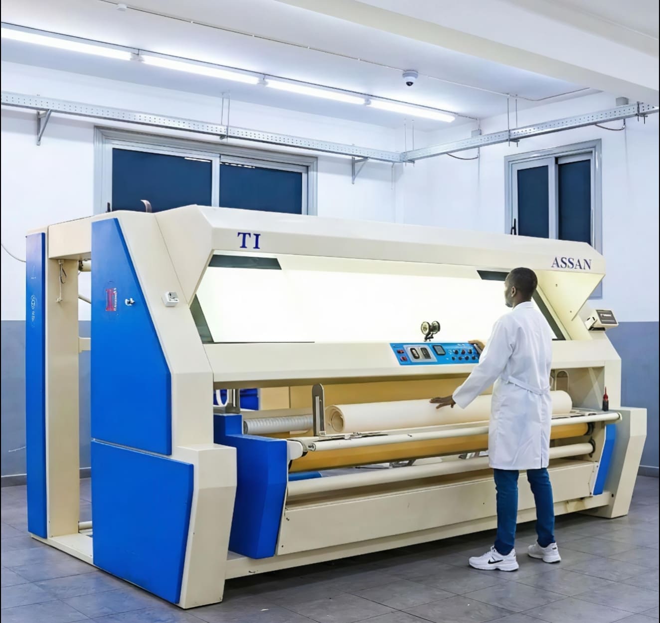 Industrial fabric processing machine.