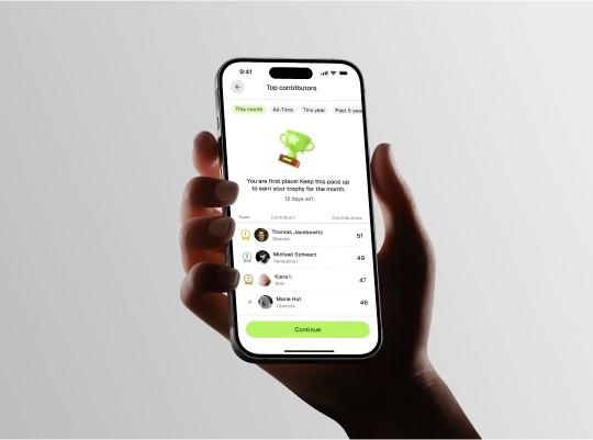 Smartphone with UI in palm with a backlit background