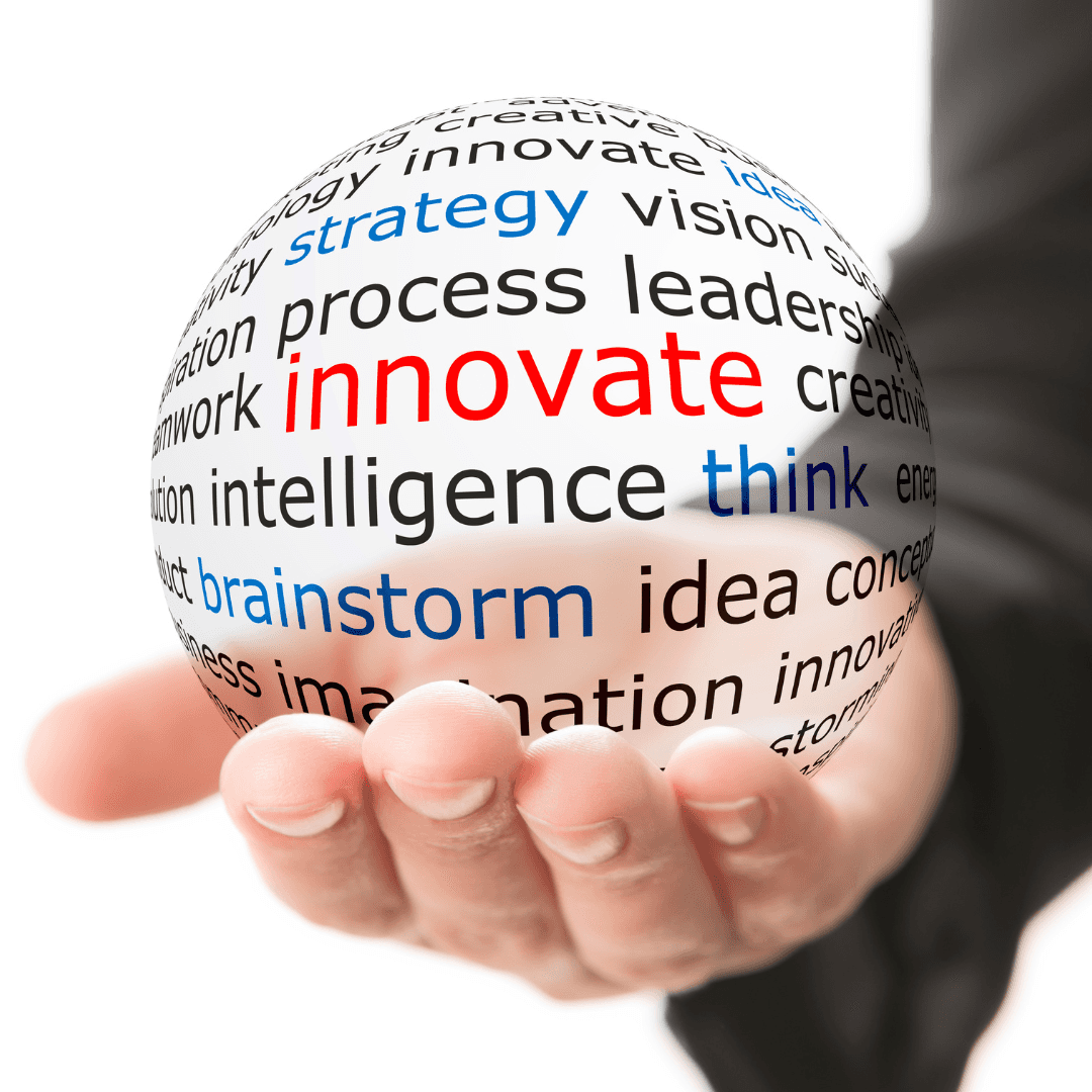 Close up of hand holding a transparent ball with words such as, innovate, brainstorm, think, strategy, idea, intelligence