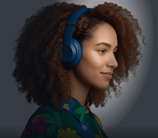 An image of a young professional learning with headphones on