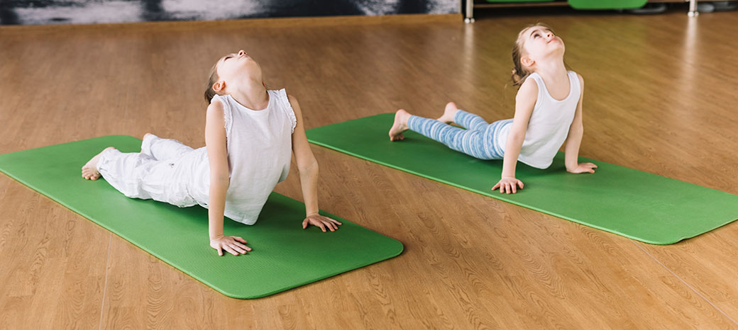 Students improving flexibility and mobility through guided stretching exercises in school fitness enrichment program