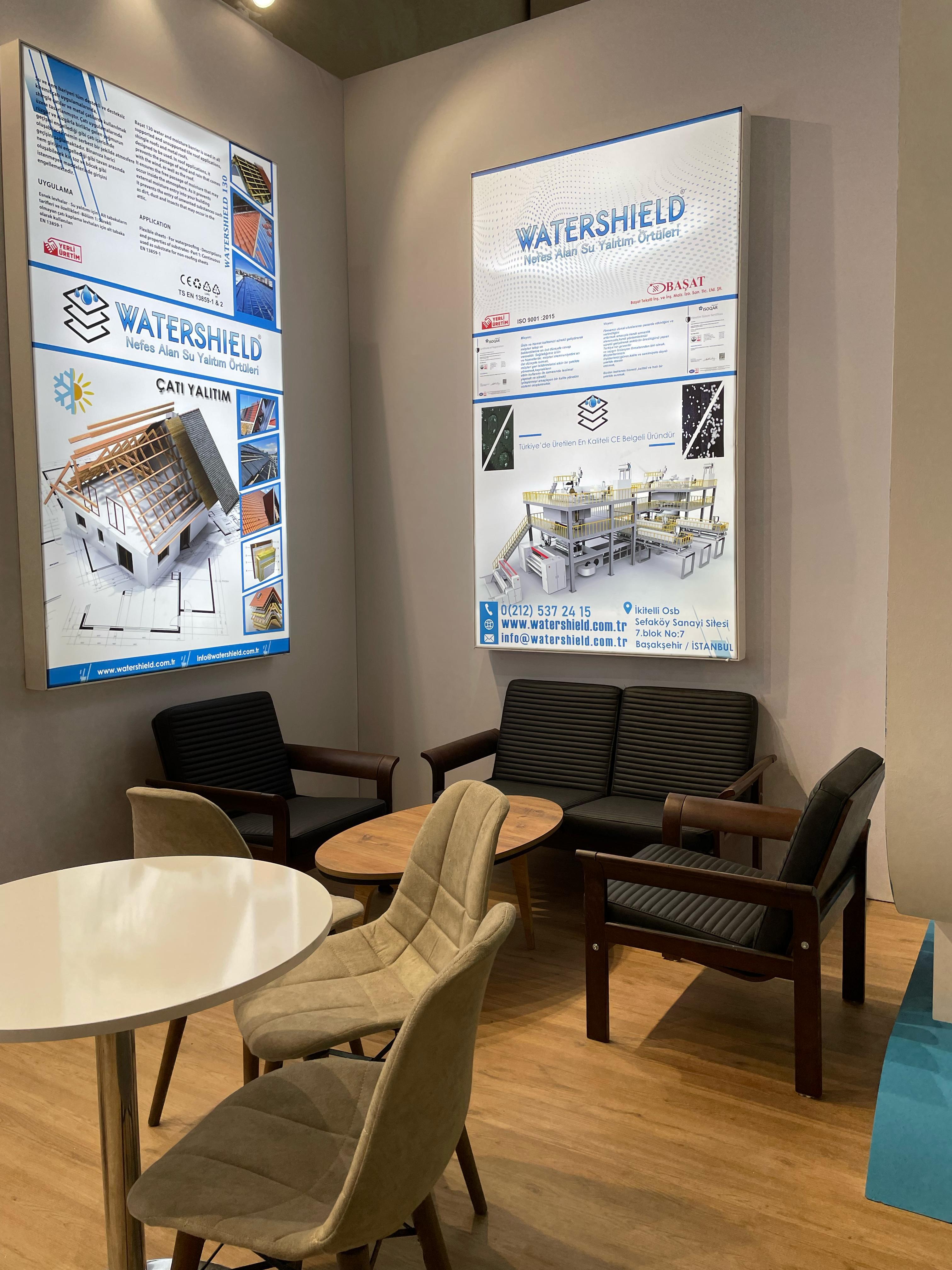 Comfortable sofa seating corner and meeting area at the Başat Watershield stand, designed for longer discussions with visitors.