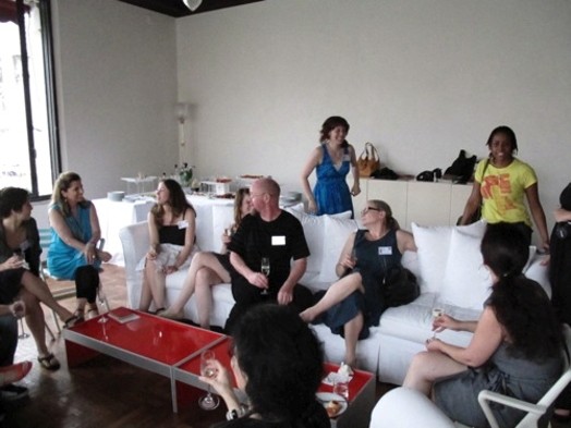 group gathered in a space with wine