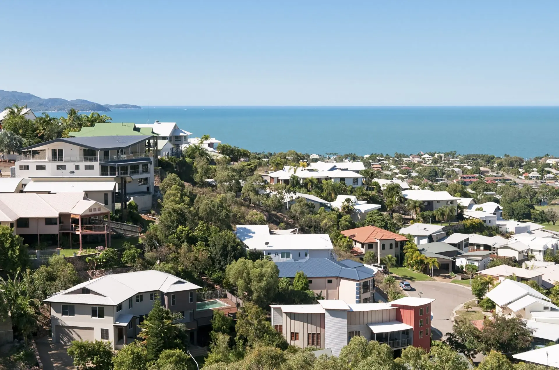 Suburban hillside neighborhood overlooking the ocean.