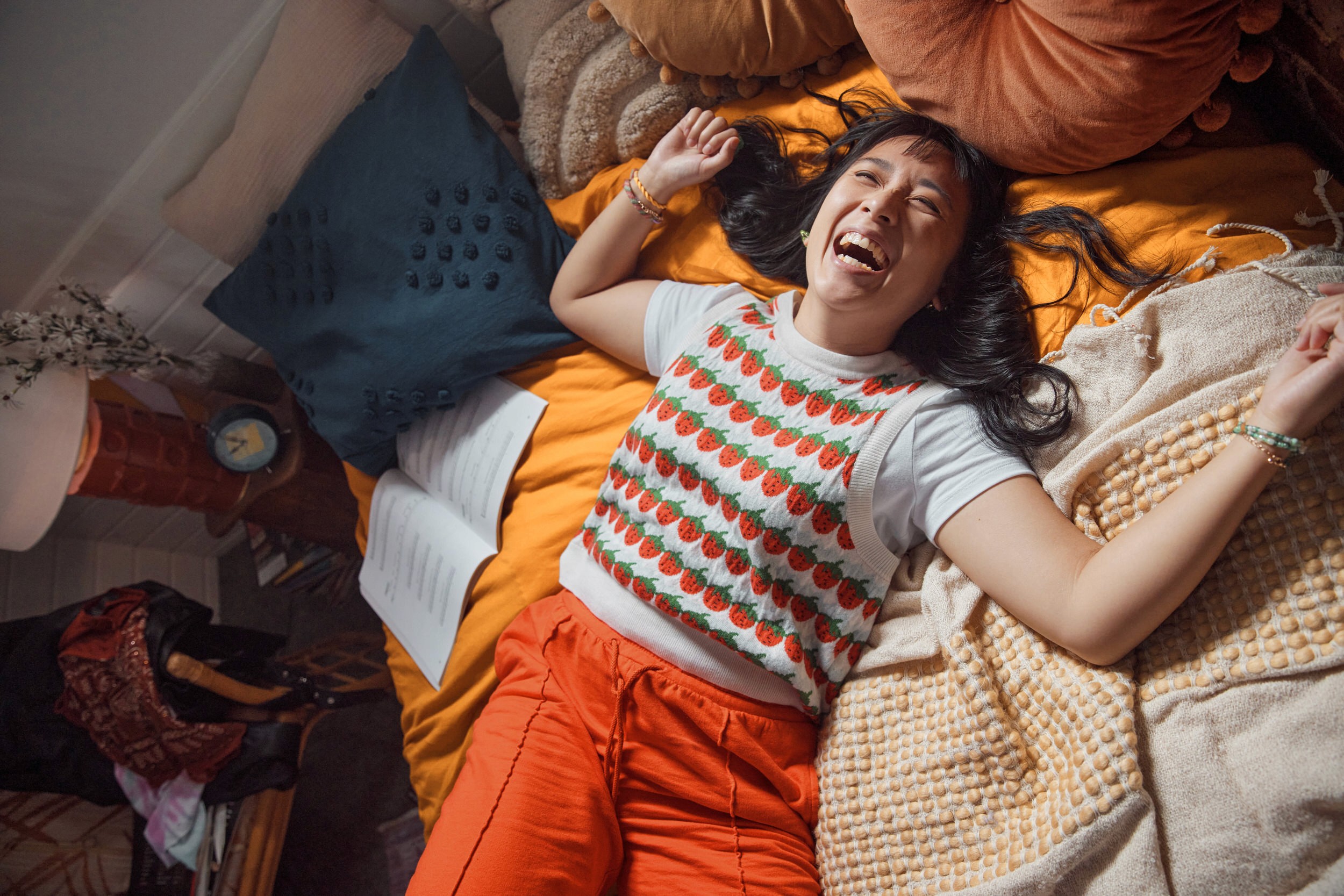 woman smiling and lying in bed