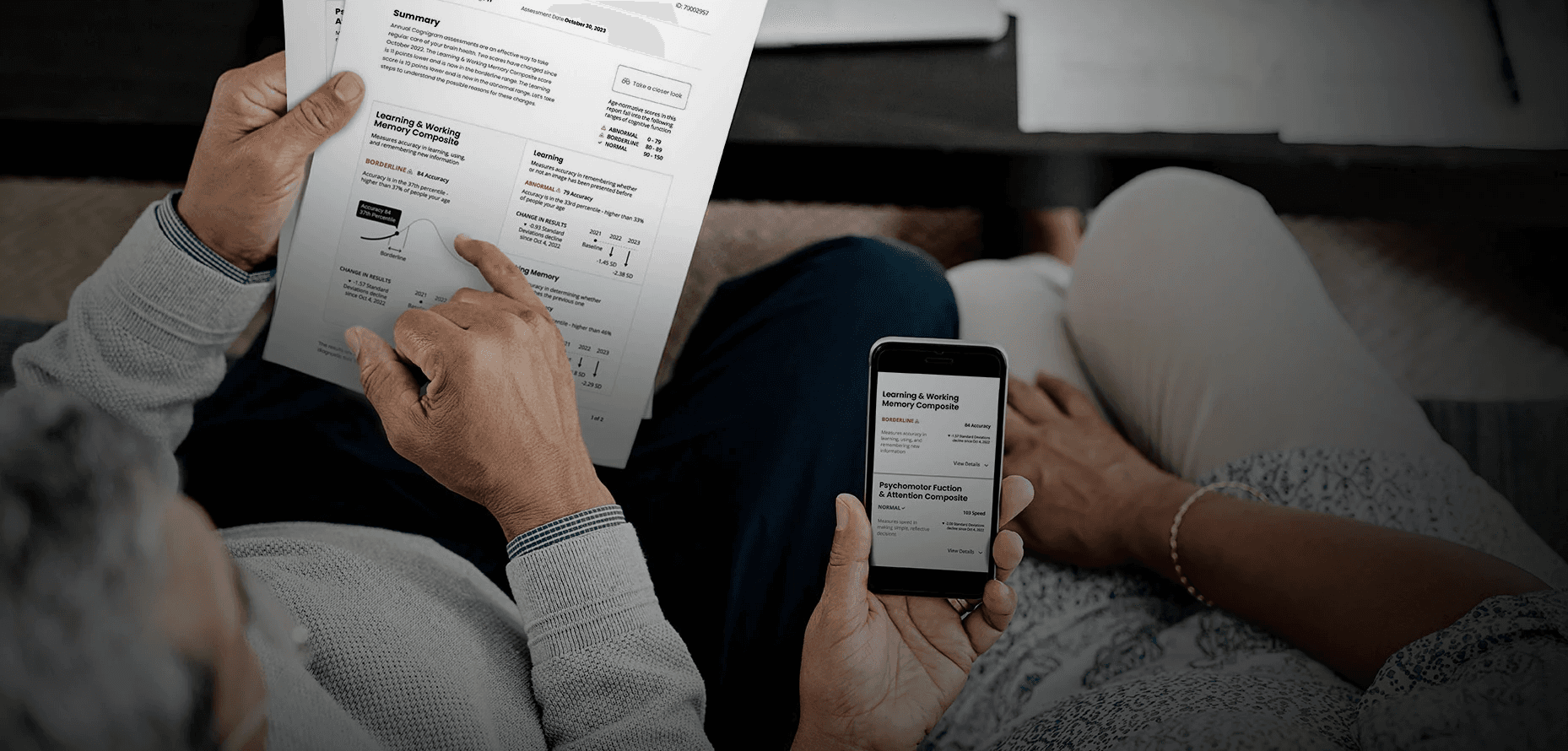 Older couple reviews the redesigned Cognigram report with simplified visuals, clear summaries, and an easy-to-read mobile version.