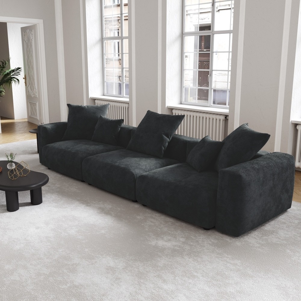 Customizable black corduroy sectional couch with soft fabric and comfortable seating, perfect for modern interiors.