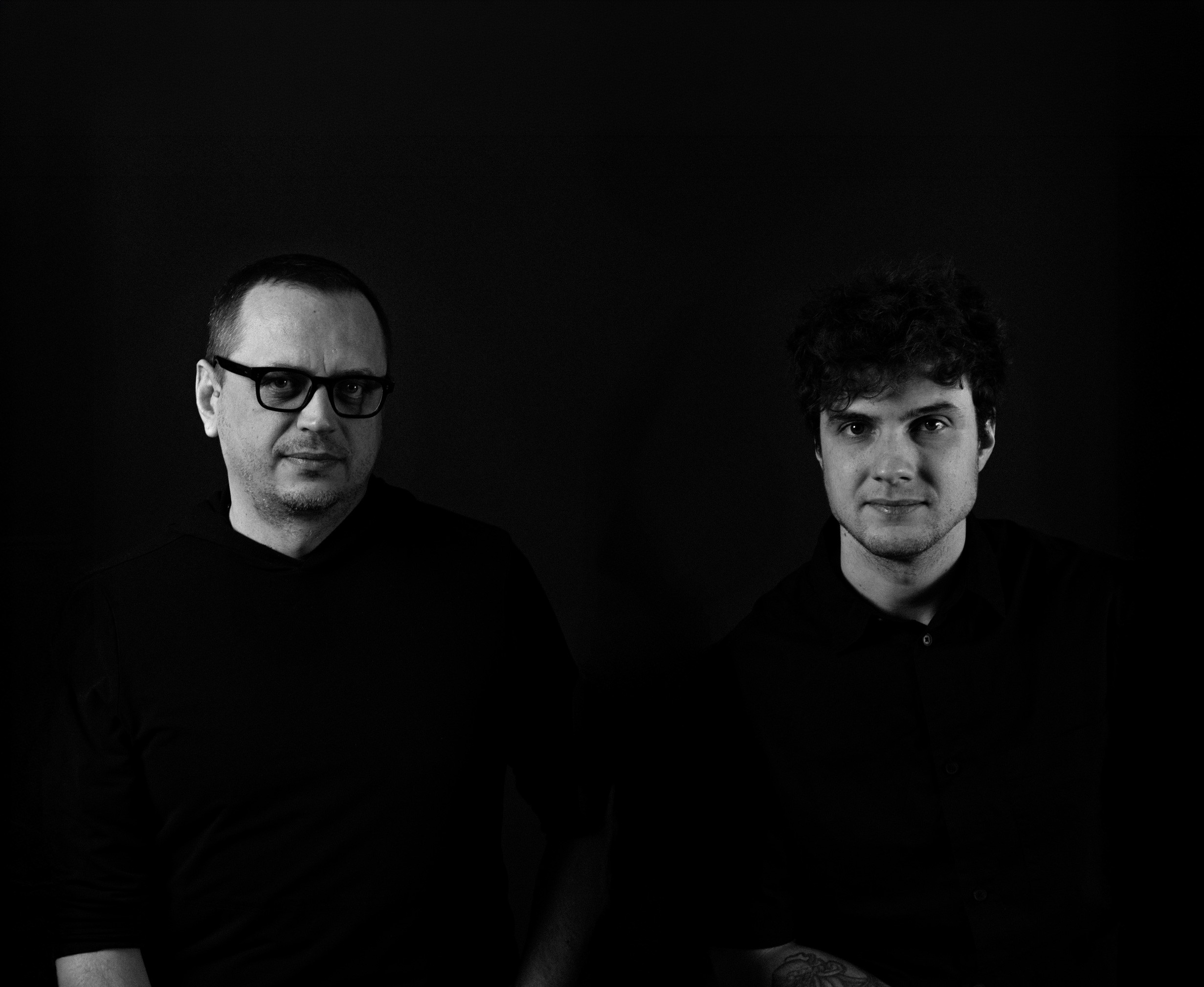 People celebrating, red stickers floating in the air