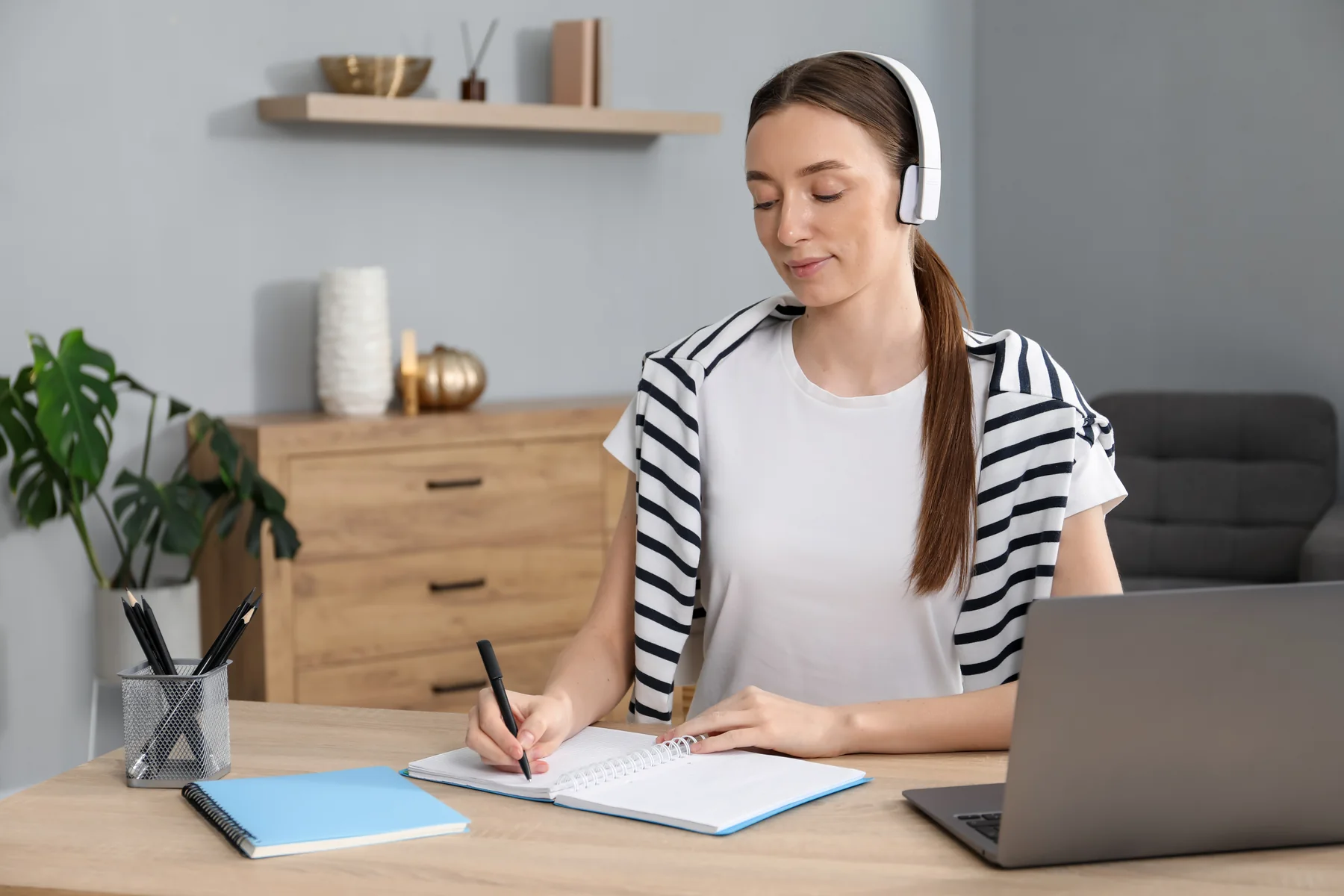 Woman Learning at Desk in Bright Home Office