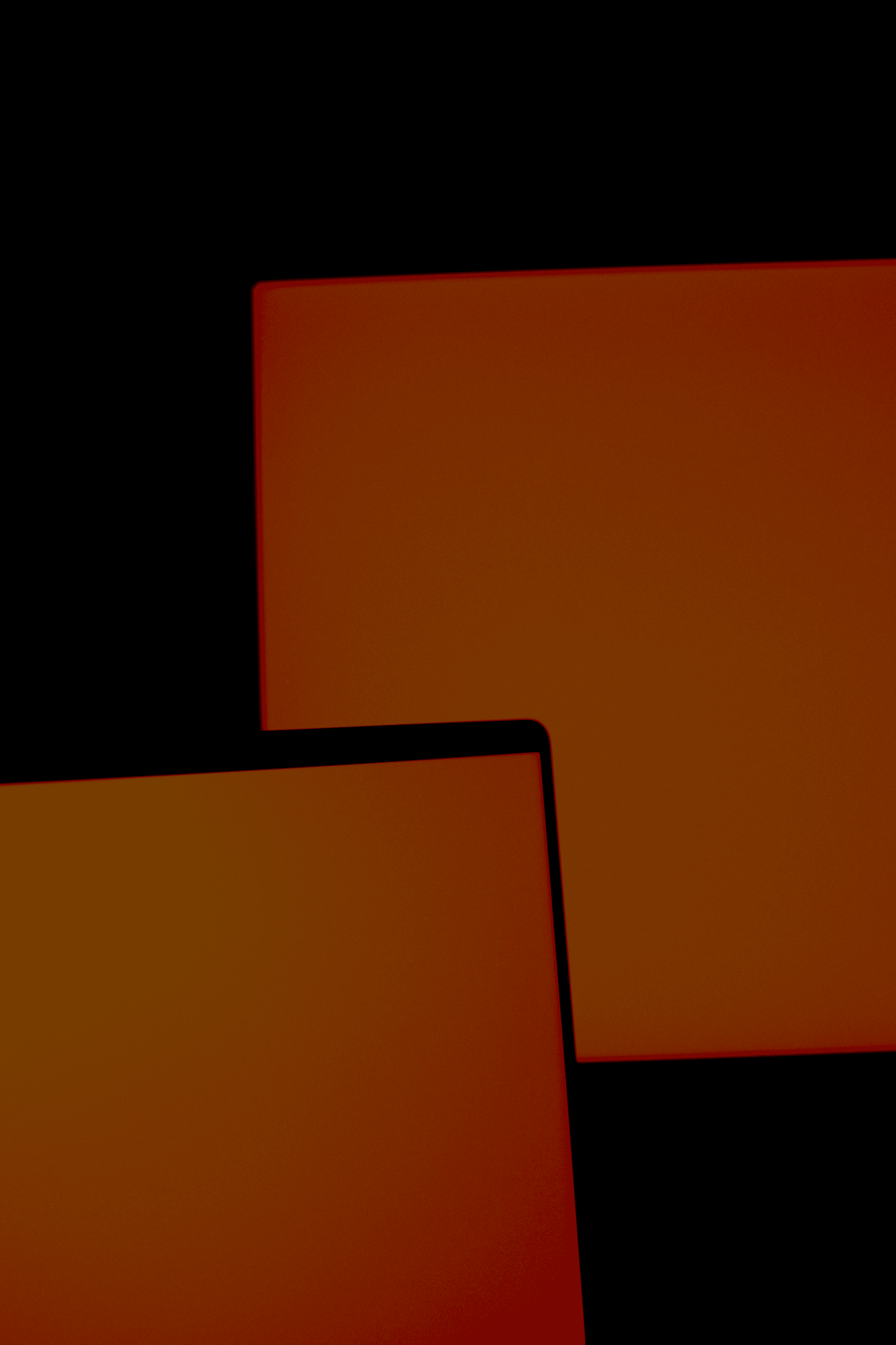 a couple of laptops sitting next to each other