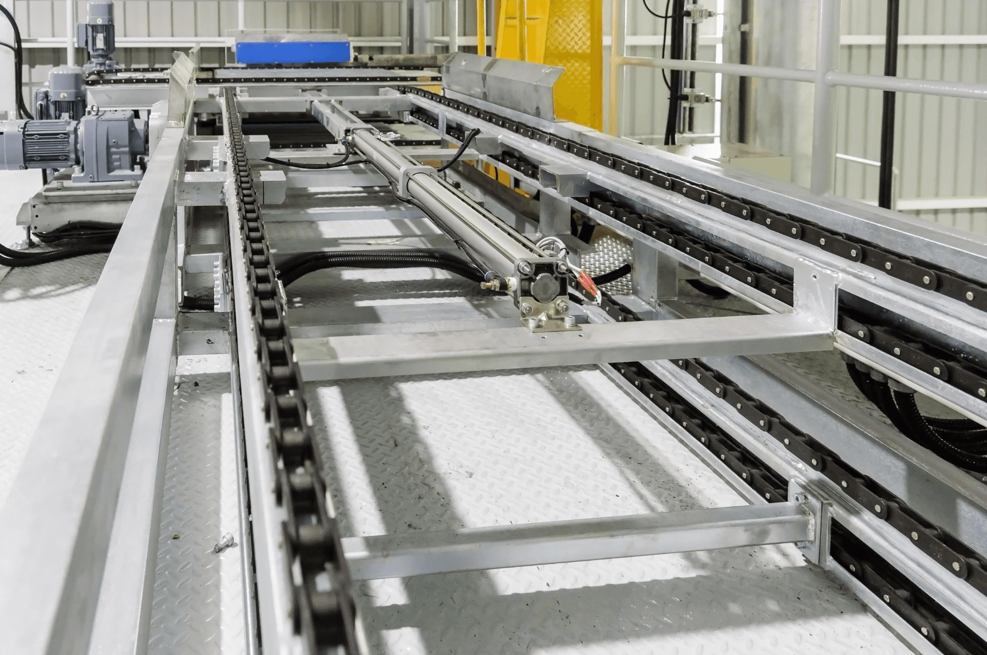 two cylindrical brown block on conveyor belt