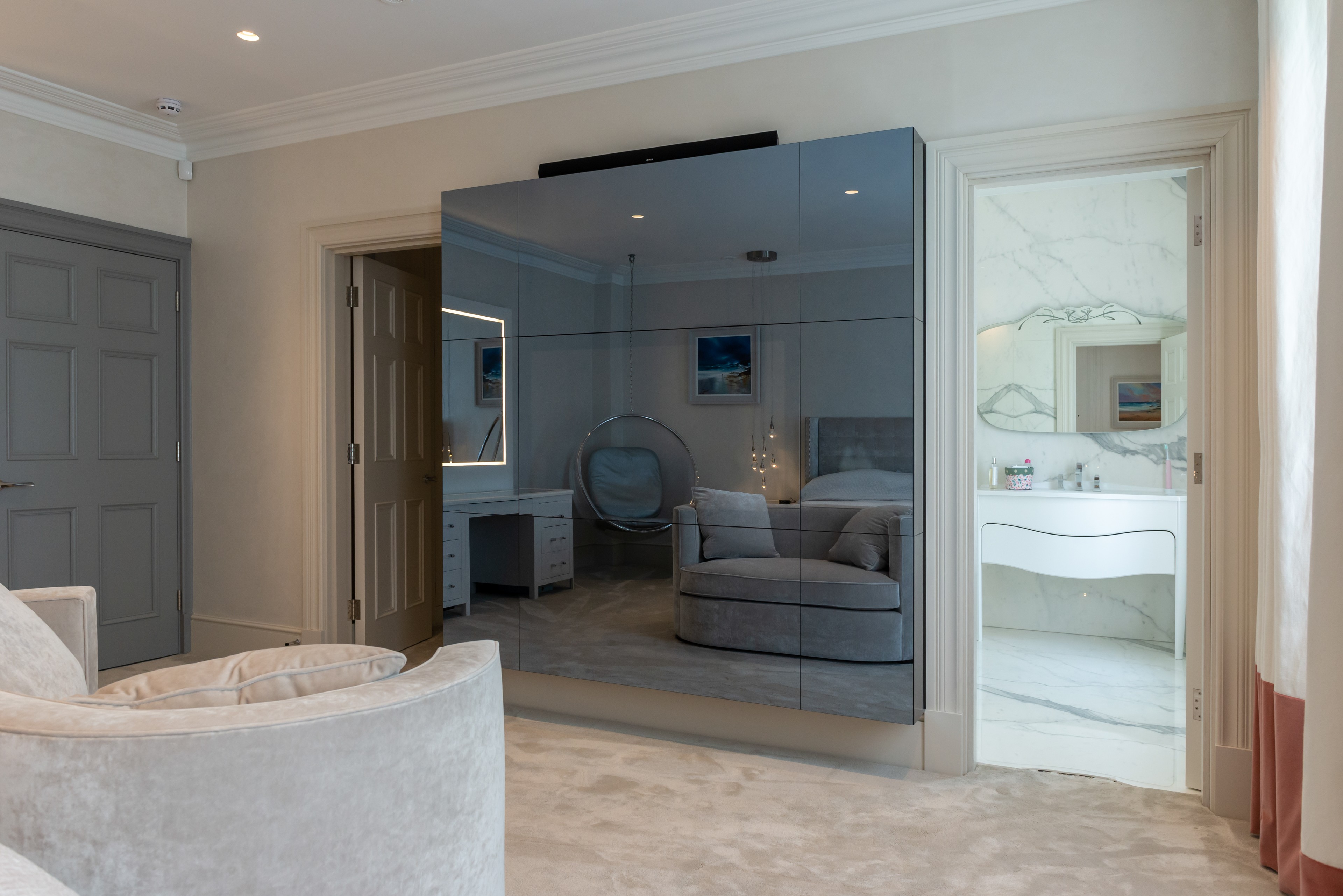 Mirrored TV cabinet, bespoke bedroom design, concealed tv cabinet in wardrobe