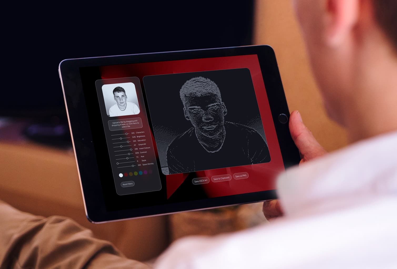 User interface of the 'Identity Compiler' tool on a tablet, showing an employee converting their headshot into a code-based ASCII art profile picture.