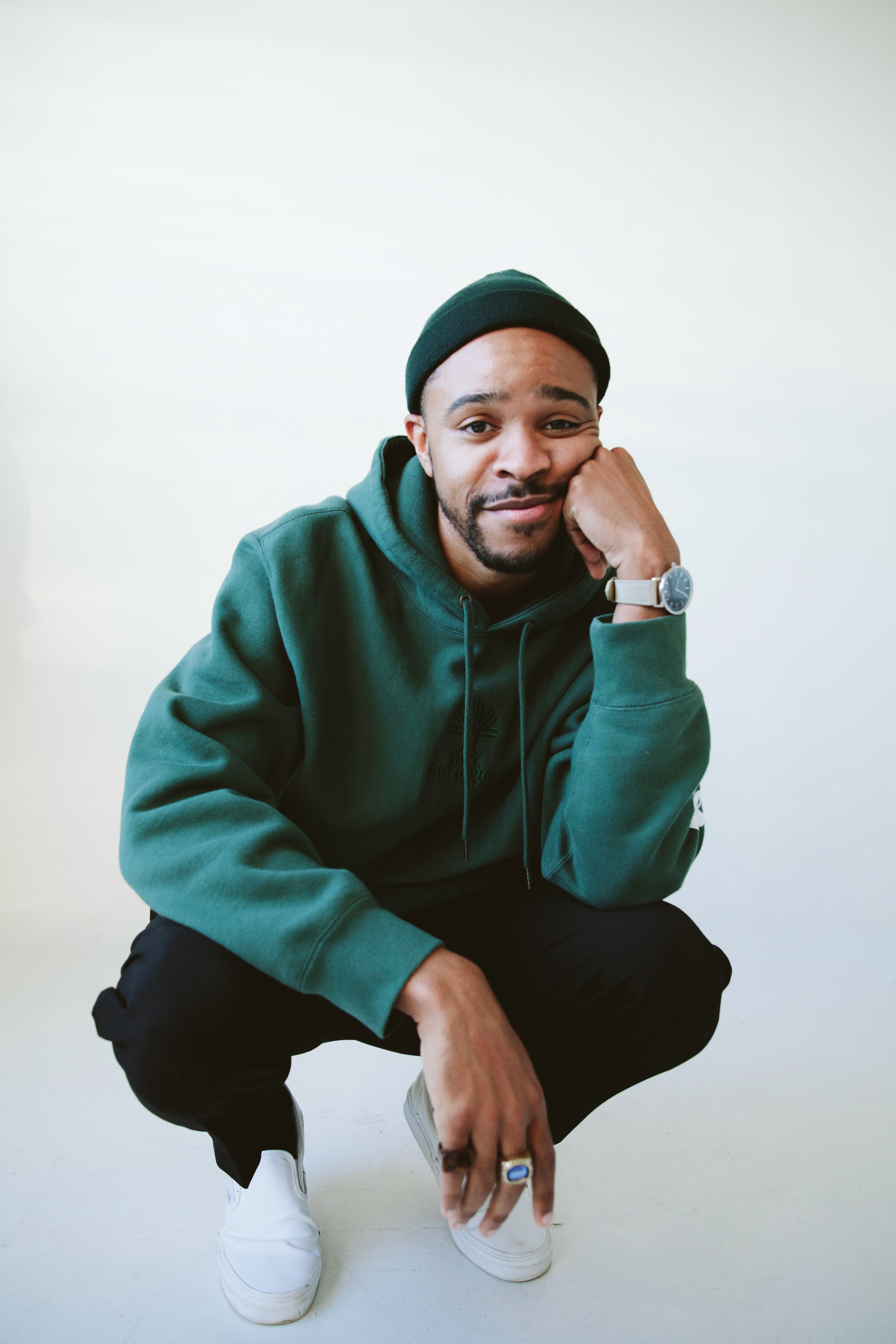 Orange tulips in a vase on a coffee table.