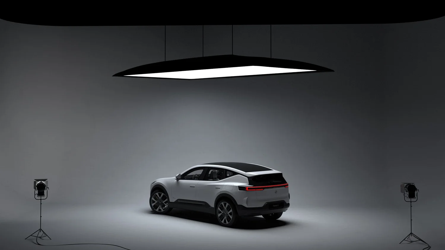 A large group photo of diverse team members gathered in an industrial-style space with arched ceiling.