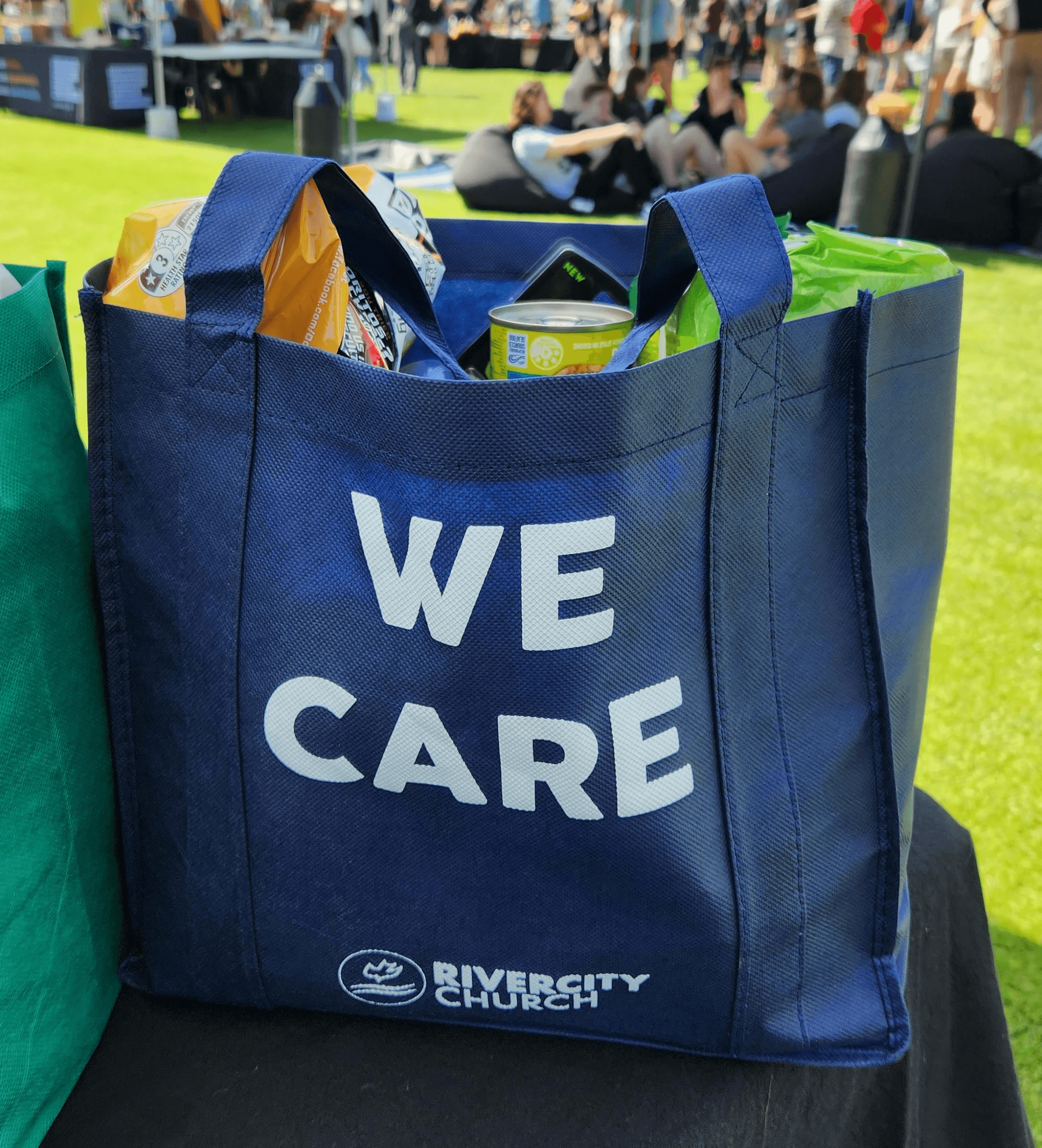 a blue tote bag sitting on top of a table