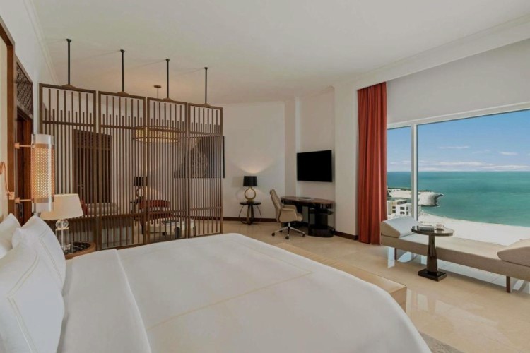 sunloungers fronting buildings near mountain