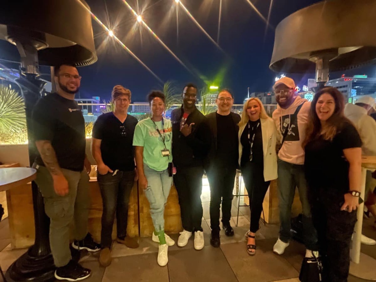 Jared Oluwa posing with a group of people after the PMC Sync Licensing Conference.