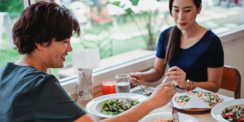 Customers happily eating at a restaurant