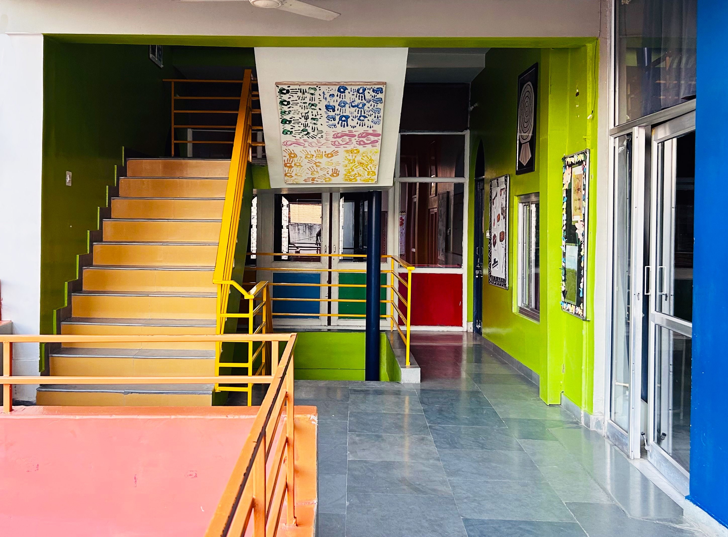 A teacher is showing a microscope to a group of students