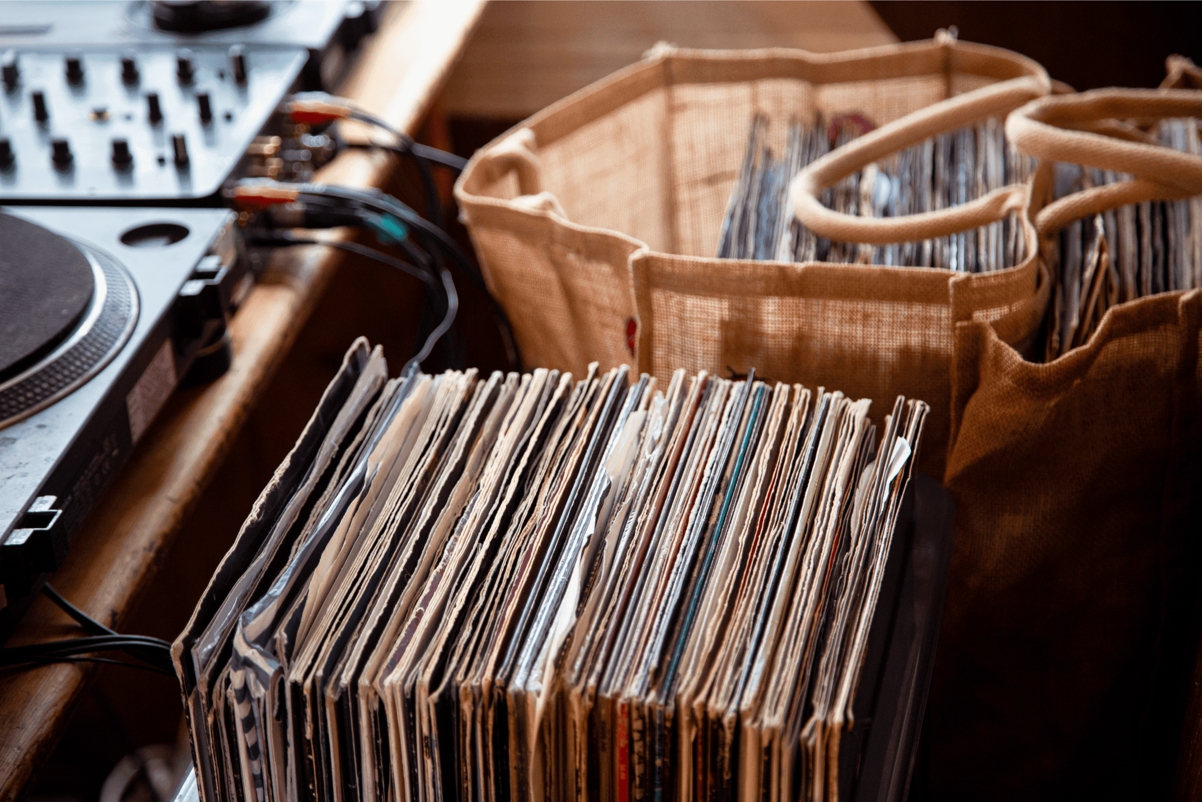 Two bags of records on a pub bench at The Bell pub Bristol