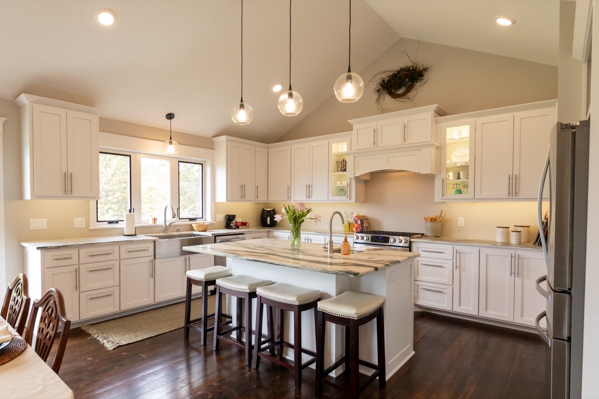 three men sitting on chair beside tables