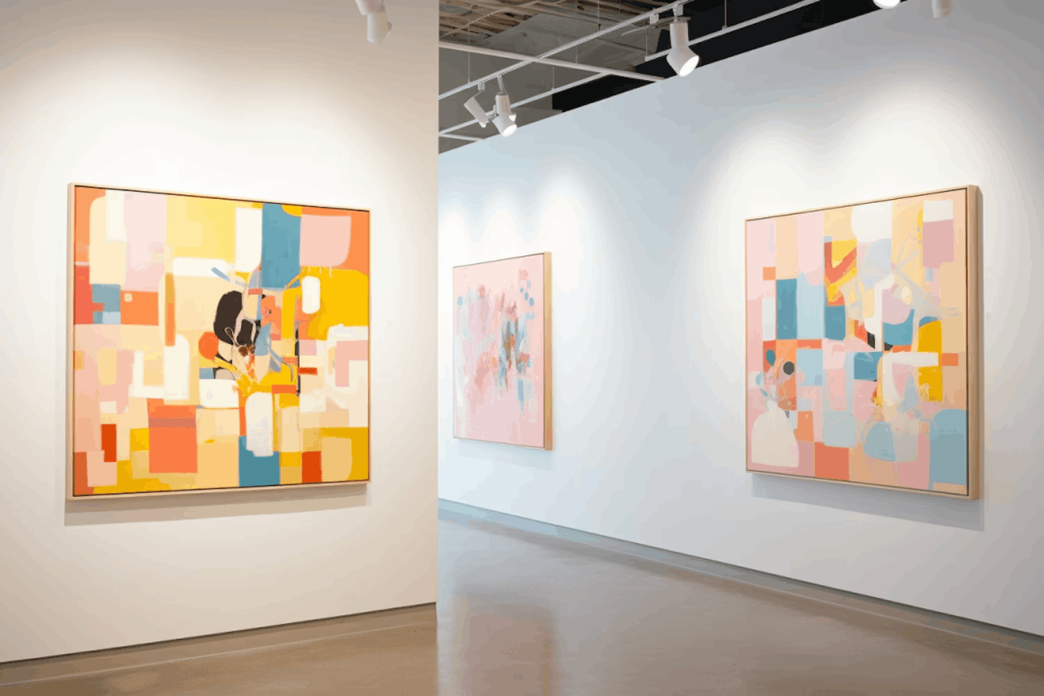 Vibrant, abstract paintings displayed in a contemporary art gallery.