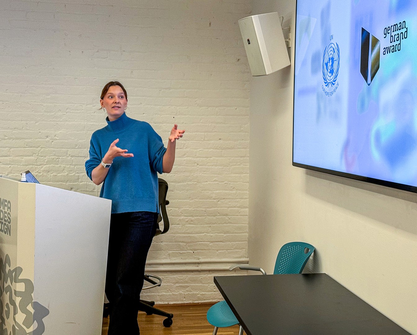 Wiebke Meyer-Luters standing at podium presenting on a screen