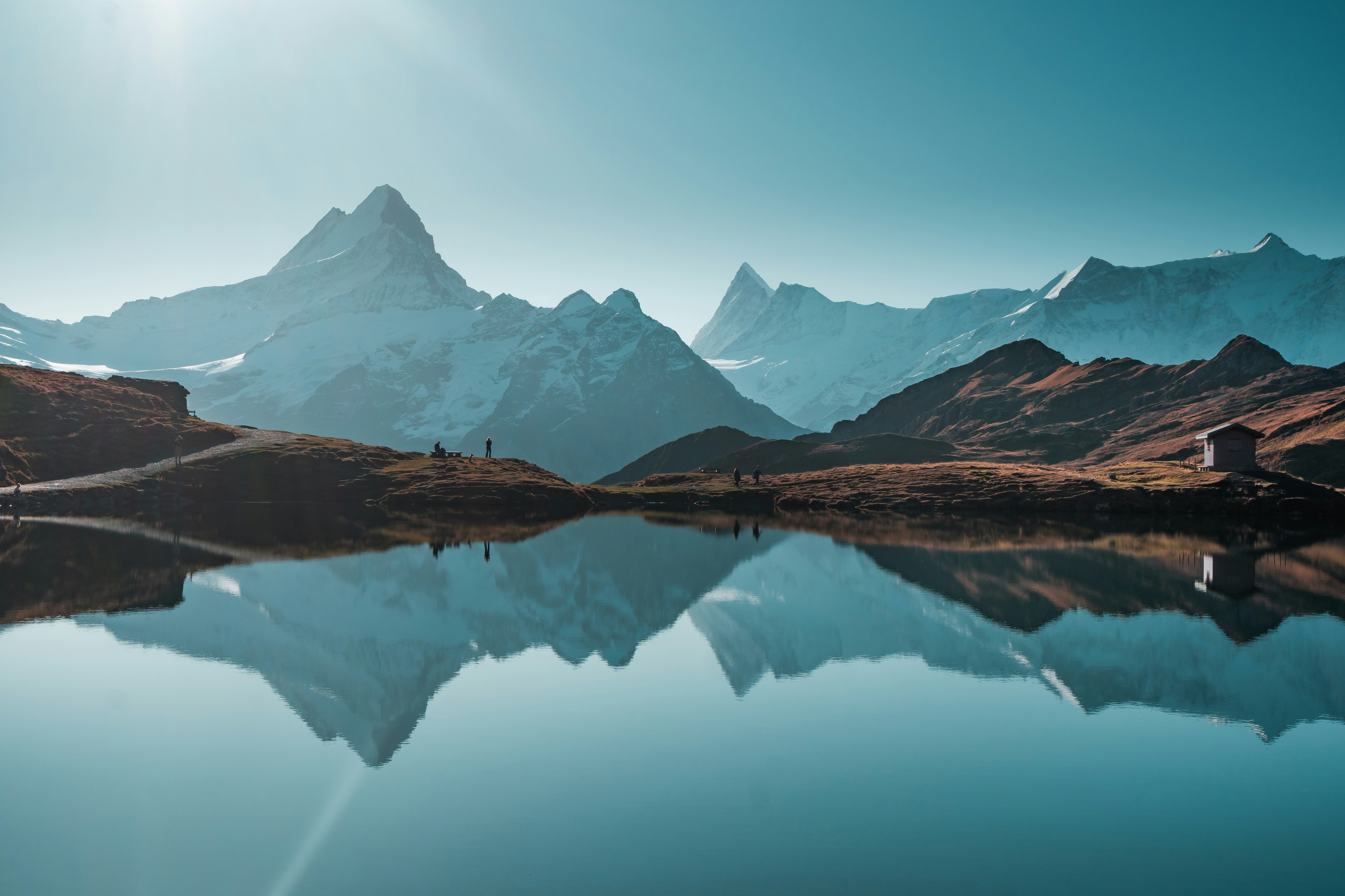 a mountain range with a lake in the foreground
