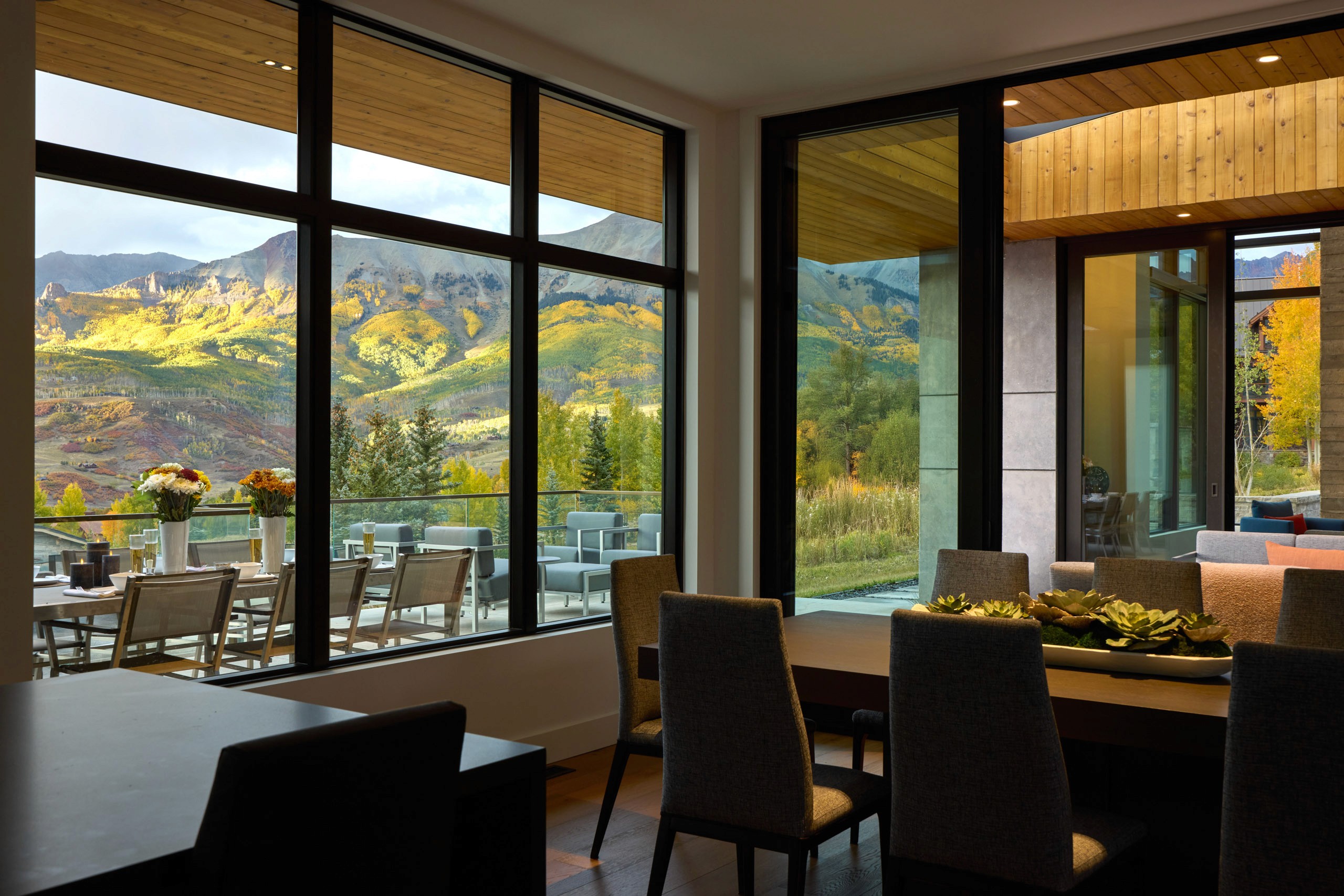 Dining room overlooks mountains with fall foliage.