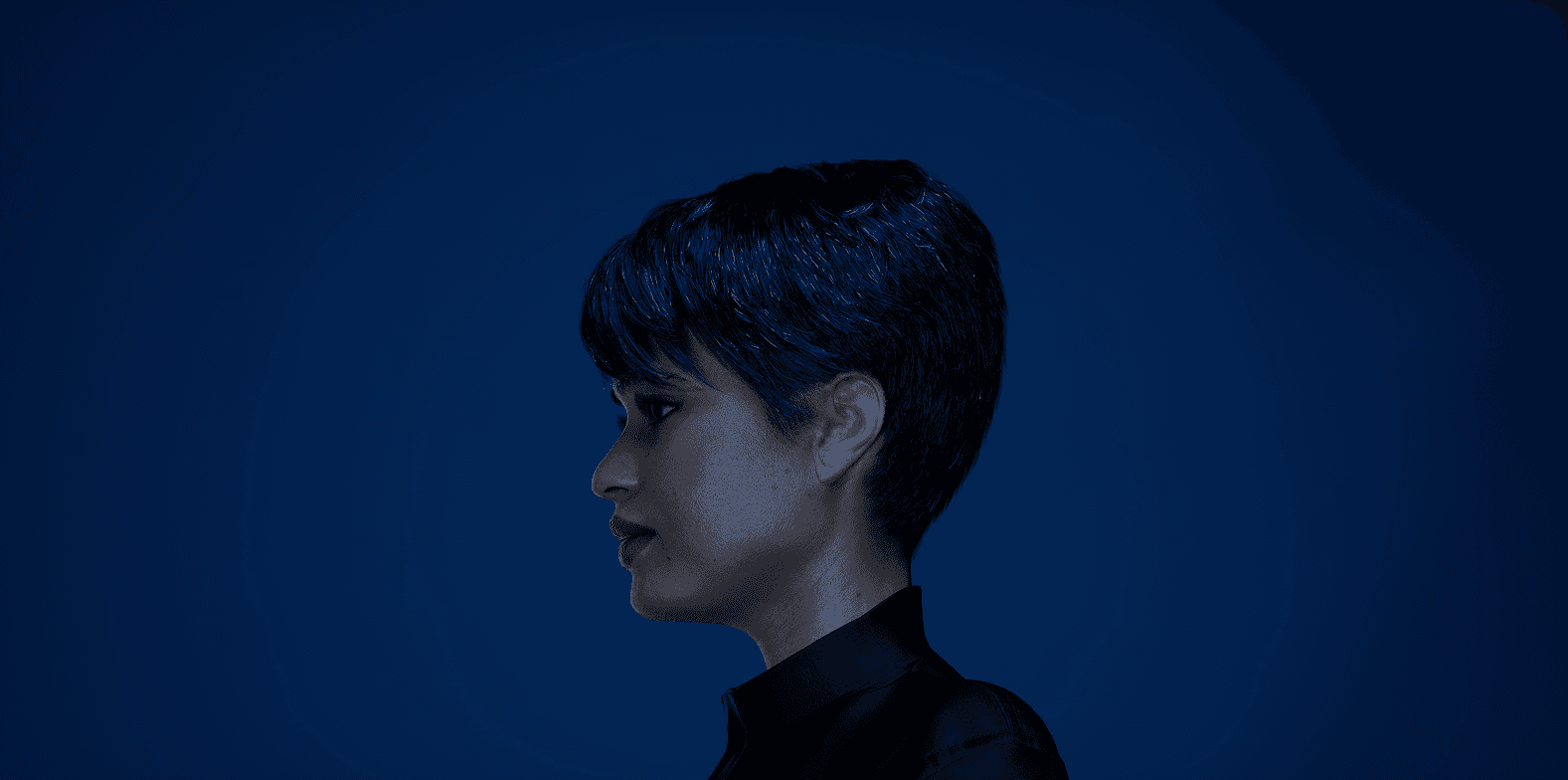 Stacked square glass jars filled with golden serum and bubbles, silver lids—luxury skincare packaging on a light background.