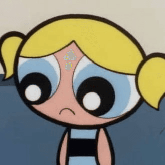 Smiling young man in a black t-shirt against a gray background, radiating warmth and friendliness.